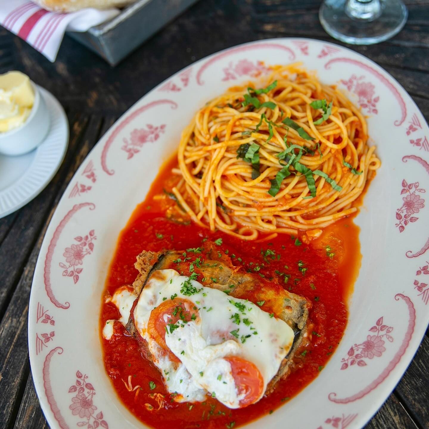 Chicken parmigiana with spaghetti pomodoro